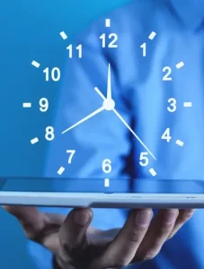 Businessman holding clock business time management